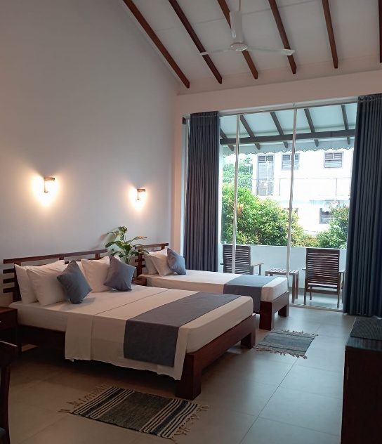 Bright deluxe room with balcony at The Ritz Hikkaduwa